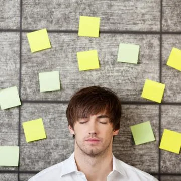 Businessman with adhesive notes Stock Photos