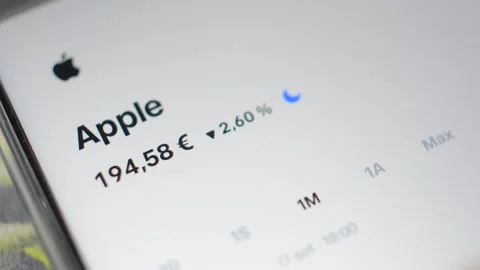 Businessman analysis Apple trading chart stock on trade republic app. Video stock 286977892