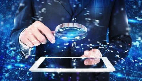 Businessman analyzes a computer system for virus and hacker attacks Stock Photos