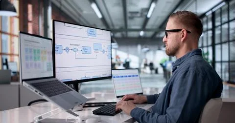 Businessman Analyzes Digital Workflow Chart While Strategizing Work Process O Stock Photos