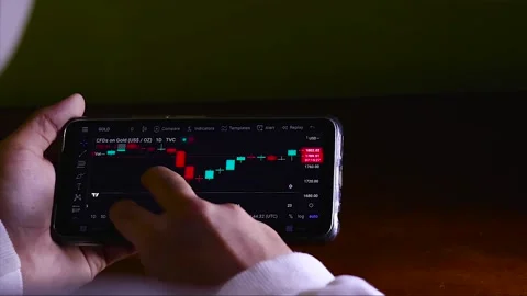 Businessman Analyzing Candlestick Chart Of a Digital Market. Video stock 170153551
