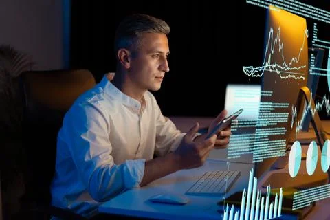 Businessman Analyzing Data on Digital Screen in Modern Office Stock Photos
