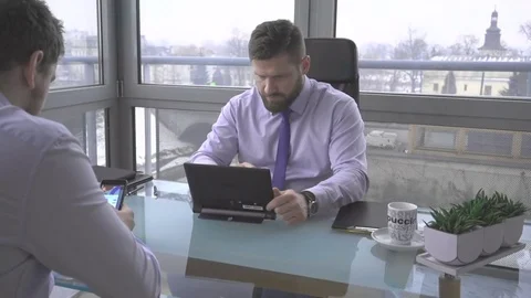 Businessman analyzing data files, tablet computer, drink coffee, office, relax 库存影片 73224974