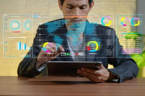Businessman Analyzing Data on Tablet with Digital Interface Elements Stock Photos
