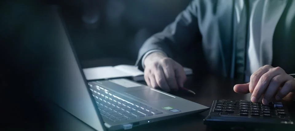 Businessman analyzing data using laptop and calculator. Stock Illustration