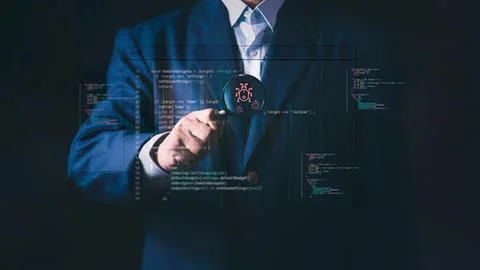 Businessman analyzing digital data with a magnifying glass Stock Photos