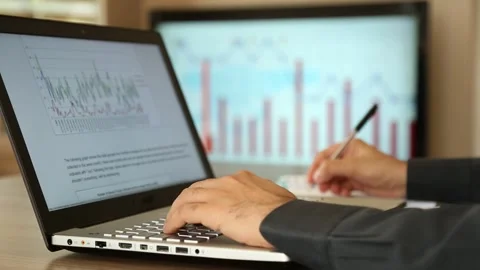 Businessman Analyzing Financial Data at Desk Stock Footage 346180085
