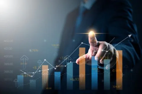 Businessman analyzing financial data on digital screen with growth chart. G.. Foto stock