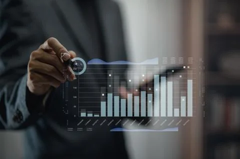 Businessman Analyzing Financial Data with Digital Graphs and Charts Stock Photos