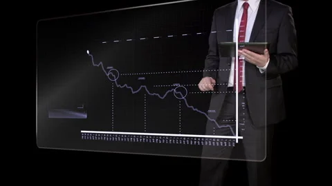 Businessman Analyzing Financial Data on Transparent Screen Stock Footage 328168857