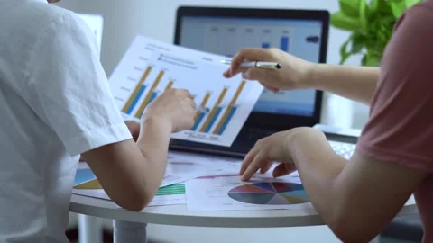Businessman analyzing financial statement and annual performance graph Stock Footage 236188962