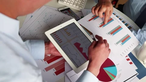 Businessman analyzing financial statistics chart Stock Footage 273861139