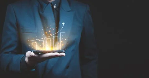 Businessman analyzing forex trading graph financial data. Stock Photos