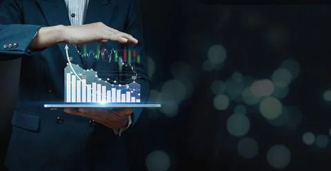 Businessman analyzing forex trading graph financial data. Stock Photos