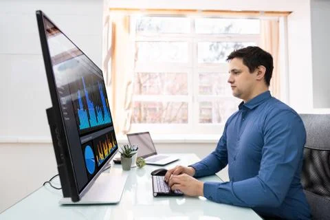 Businessman Analyzing Graphs On Computer Stock Photos