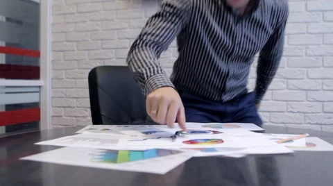Businessman Analyzing Graphs Stock-Footage 68417960