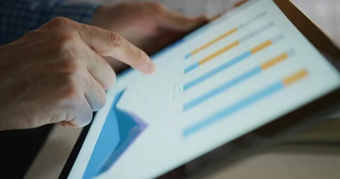 Businessman Analyzing Various Graphs On Digital Tablet At Home 4K Stock Footage 92437065