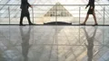 The businessman and a businesswoman handshake in the office hall. slow motion 4k or 4k+ Resolution