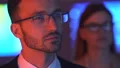 The businessman and a businesswoman smiling in the dark room 4k or 4k+ Resolution