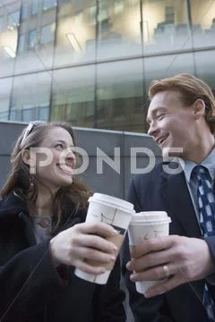 Businessman and businesswoman taking coffee break Stock Photos