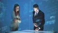 The businessman and a businesswoman working with a hologram 4k or 4k+ Resolution