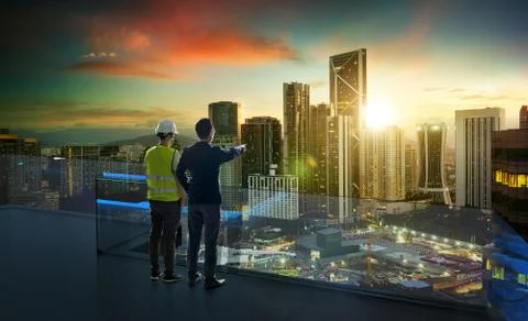 Businessman and developer engineer standing on open roof top balcony Stock-Fotos