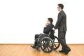 The businessman and a disabled phone on the white wall background Photo