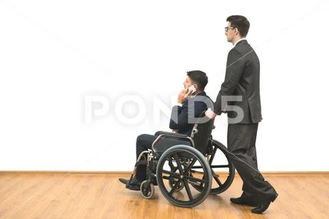 The businessman and a disabled phone on the white wall background Stock Photos
