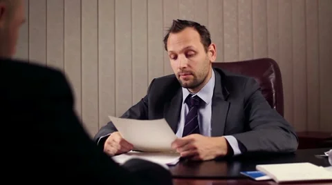 Businessman and man having job interview in a office HD Stock Footage