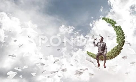 Businessman announcing something in loudspeaker and paper planes Stock Photos