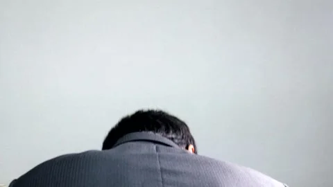 A businessman apologizing over the phone Stock Footage 336413804