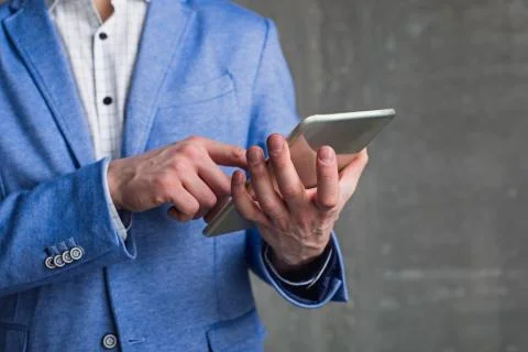 Businessman arm using digital device Stock-Fotos
