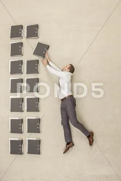 Businessman arranging files Stock Photos