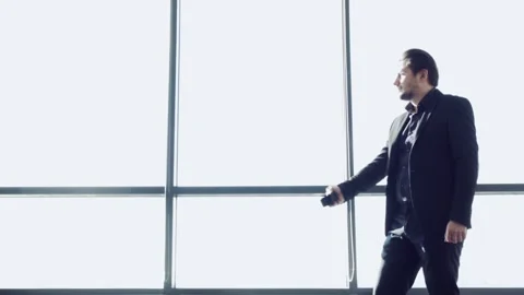 Businessman on background of large panoramic window. Stock-Footage 96413195