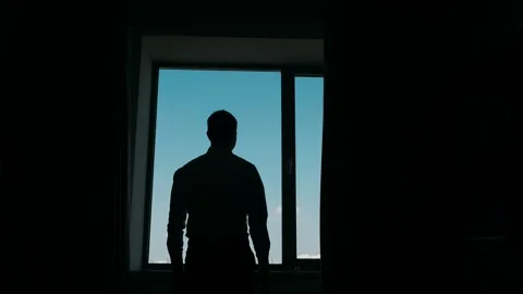 Businessman in backlight opens curtains Stock Footage 270892073