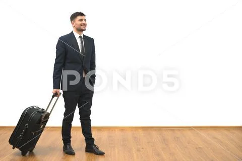 The businessman with a bag standing on the white wall background Stock Photos