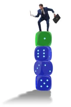 Businessman balancing on top of dice stack in uncertainty concep Stock Photos