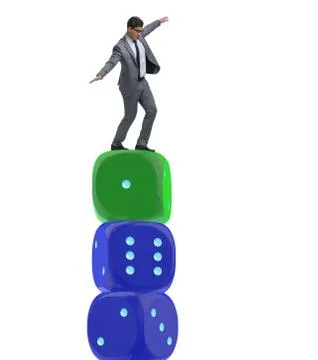 Businessman balancing on top of dice stack in uncertainty concep Stock Photos