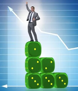 Businessman balancing on top of dice stack in uncertainty concep Stock Photos