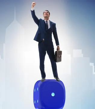 Businessman balancing on top of dice stack in uncertainty concep Stock Photos