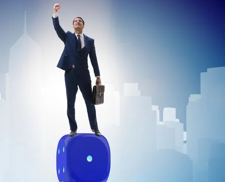 Businessman balancing on top of dice stack in uncertainty concep Stock Photos