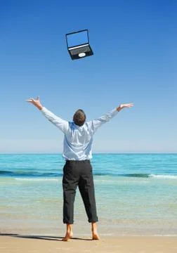 Businessman  on the beach Stock Photos