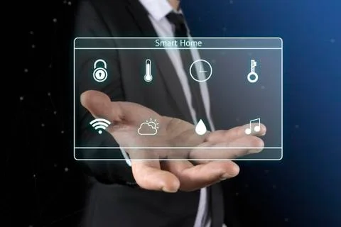 Businessman on blurred background using smart home digital interface Stock Photos