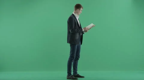 Businessman with a book Stock Footage 64780648