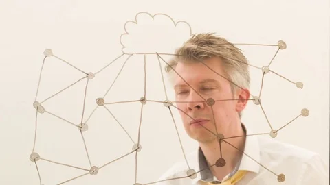 Businessman brainstorming drawing an image of a cloud network Stock-Footage 80734149