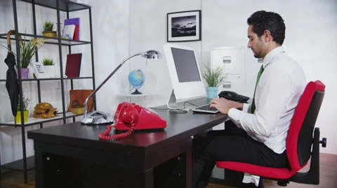 Businessman breaking office computer under pressure and stress Stock-Footage 32948685