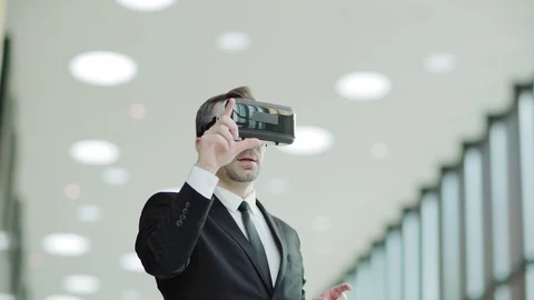 Businessman browsing data in VR glasses Video stock 108681784