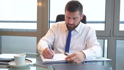 Businessman browsing documents, making notes, office, portrait, slider shot 库存影片 72500440