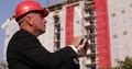 Businessman in a Building Site Access Online Technical Information Using Tablet 4k or 4k+ Resolution