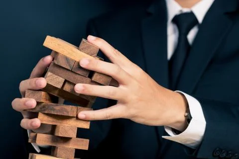 Businessman Builds a Tower Stock Photos